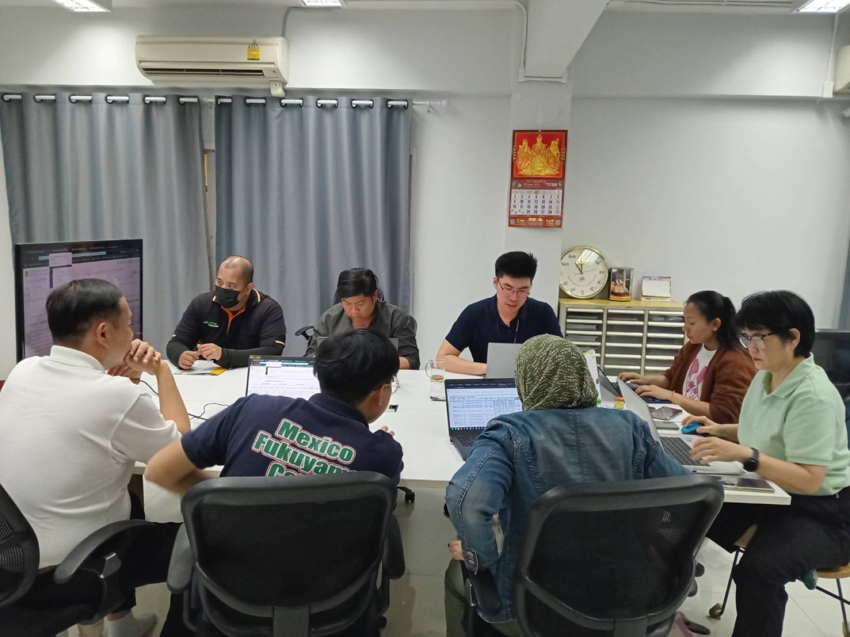 Michael leading a working meeting with a team
